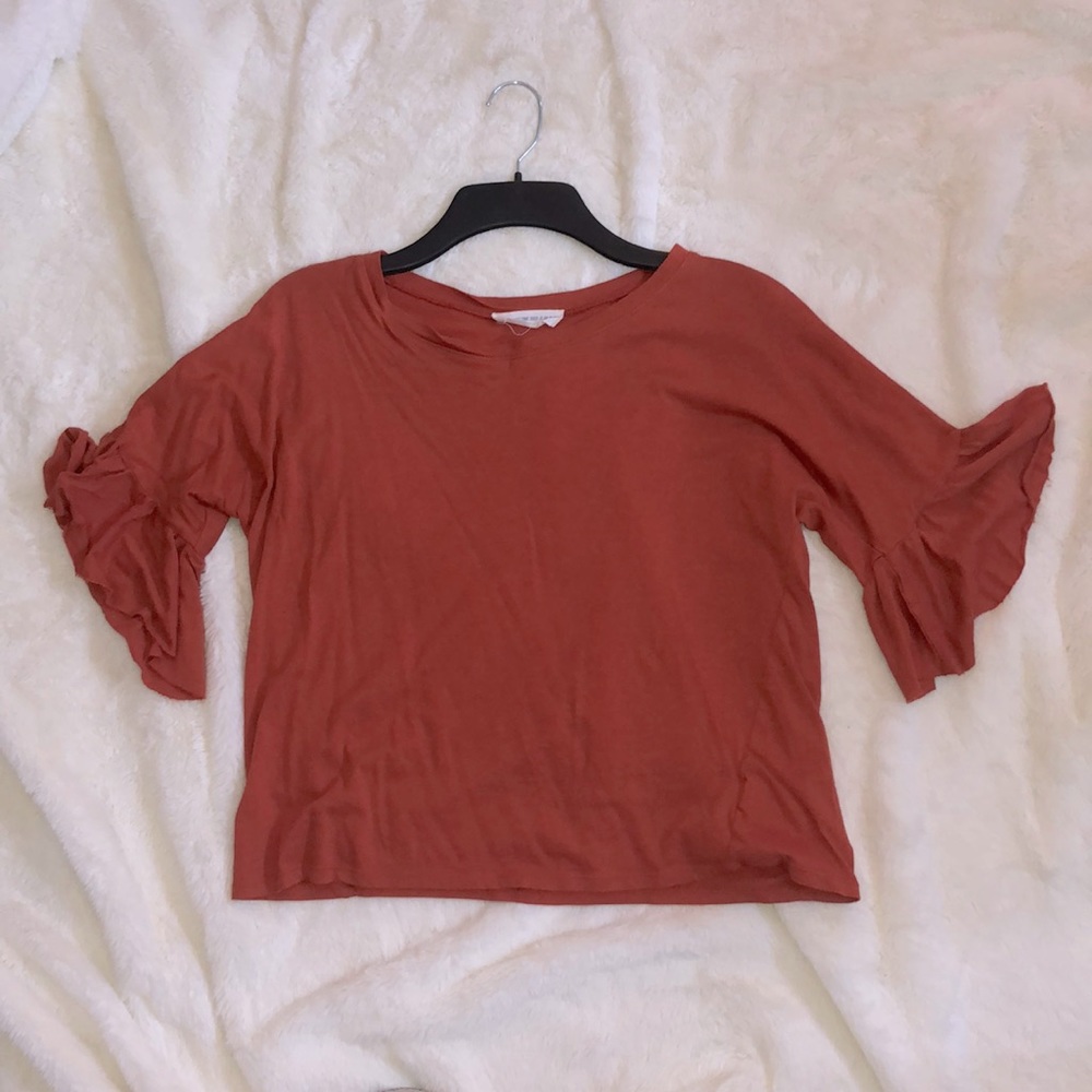 Burnt orange blouse, ruffled sleeves, used